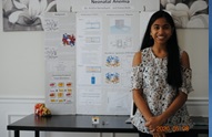 A person standing in front of a white board    Description automatically generated with medium confidence
